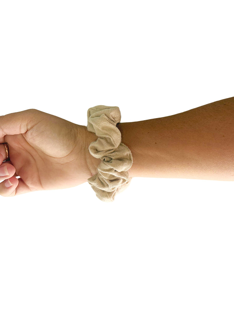 Arius Good Earth Cotton Sand coloured Scrunchie worn on arm with white background. 