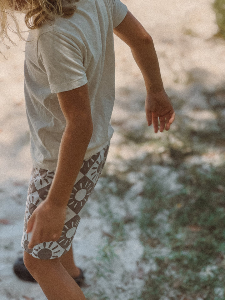 Natural organic cotton kids t-shirt on beach in Australia