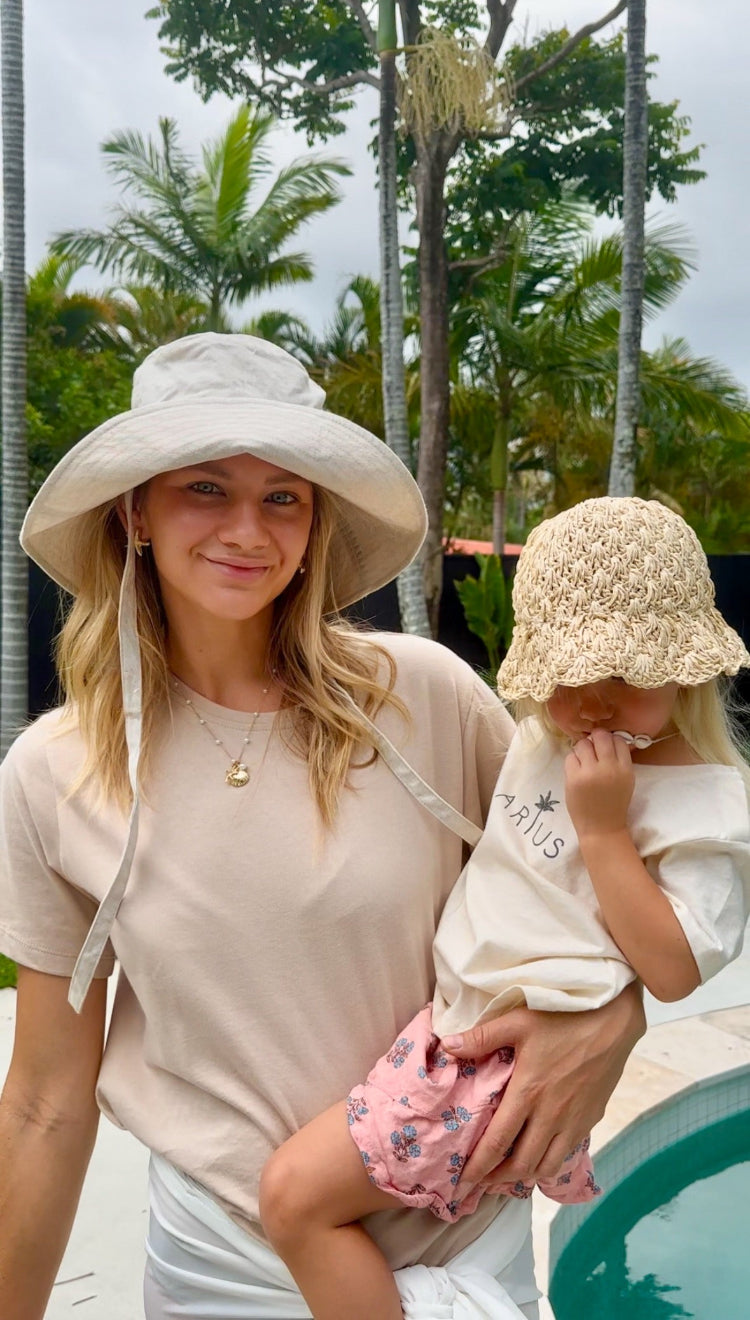 Mum and baby poolside in Arius Good Earth Cotton The Vera T-shirt and Arius baby chiller t-shirt. 