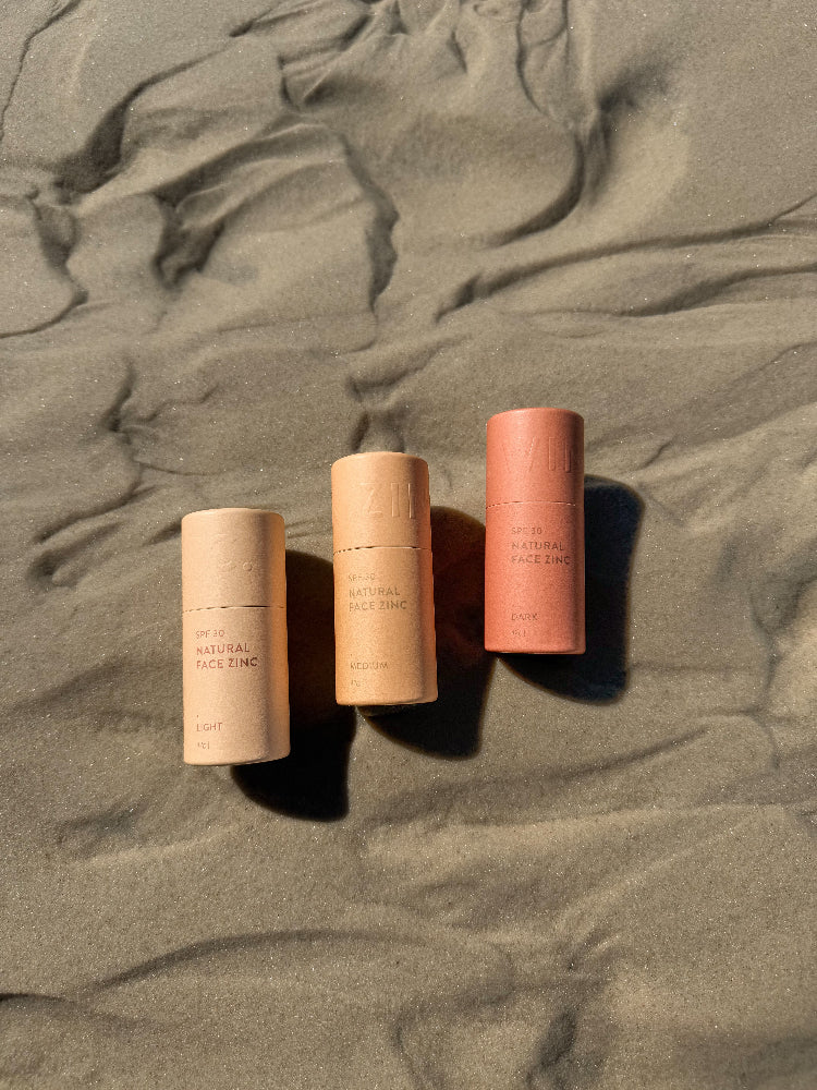 Winki Zinc natural face zinc collection on sand at beach