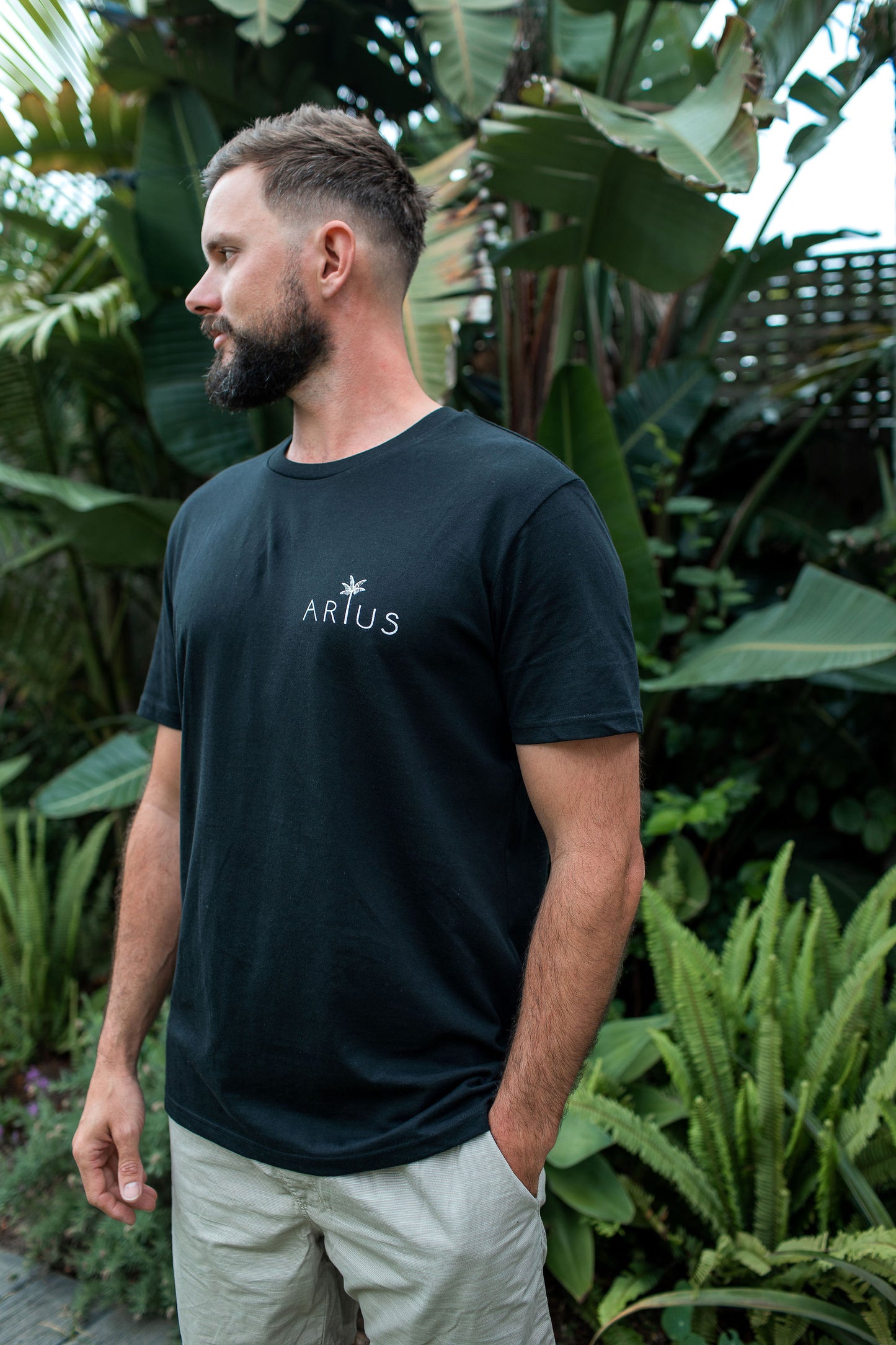 Man wearing organic cotton t-shirt with palm tree design