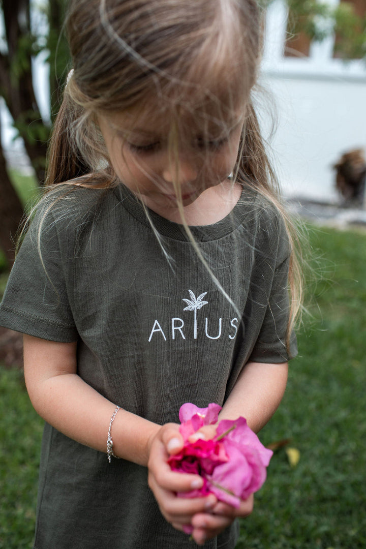 Organic Cotton kids t-shirt in khaki on girl with pink flower