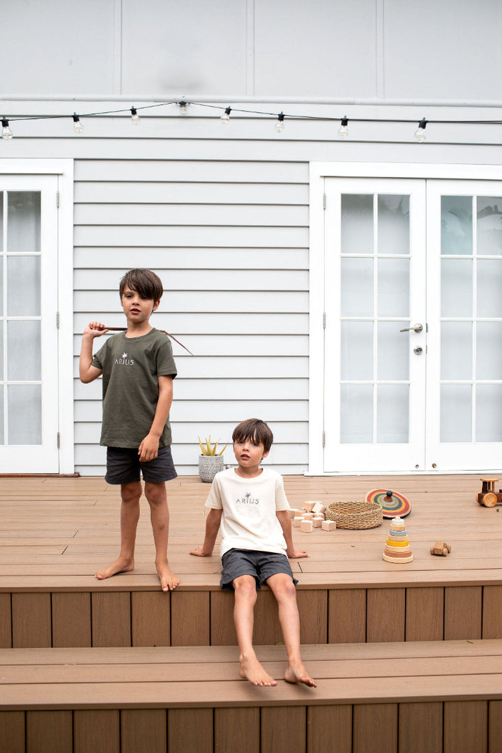 Twin boys wearing matching organic cotton kids t-shirts